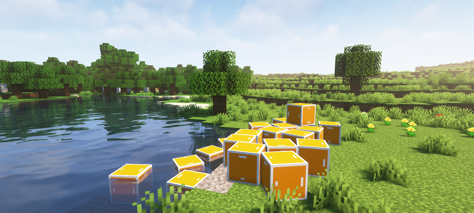 Physics boxes spread out across a grassy plain in Minecraft